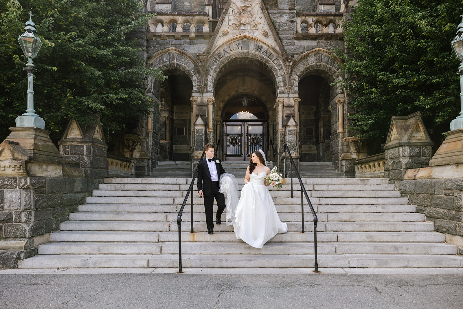 bride and groom on steps of healy hall at georgetown university wedding