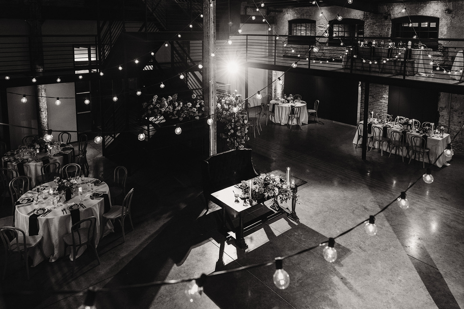 the winslow wedding reception with hanging bistro lights